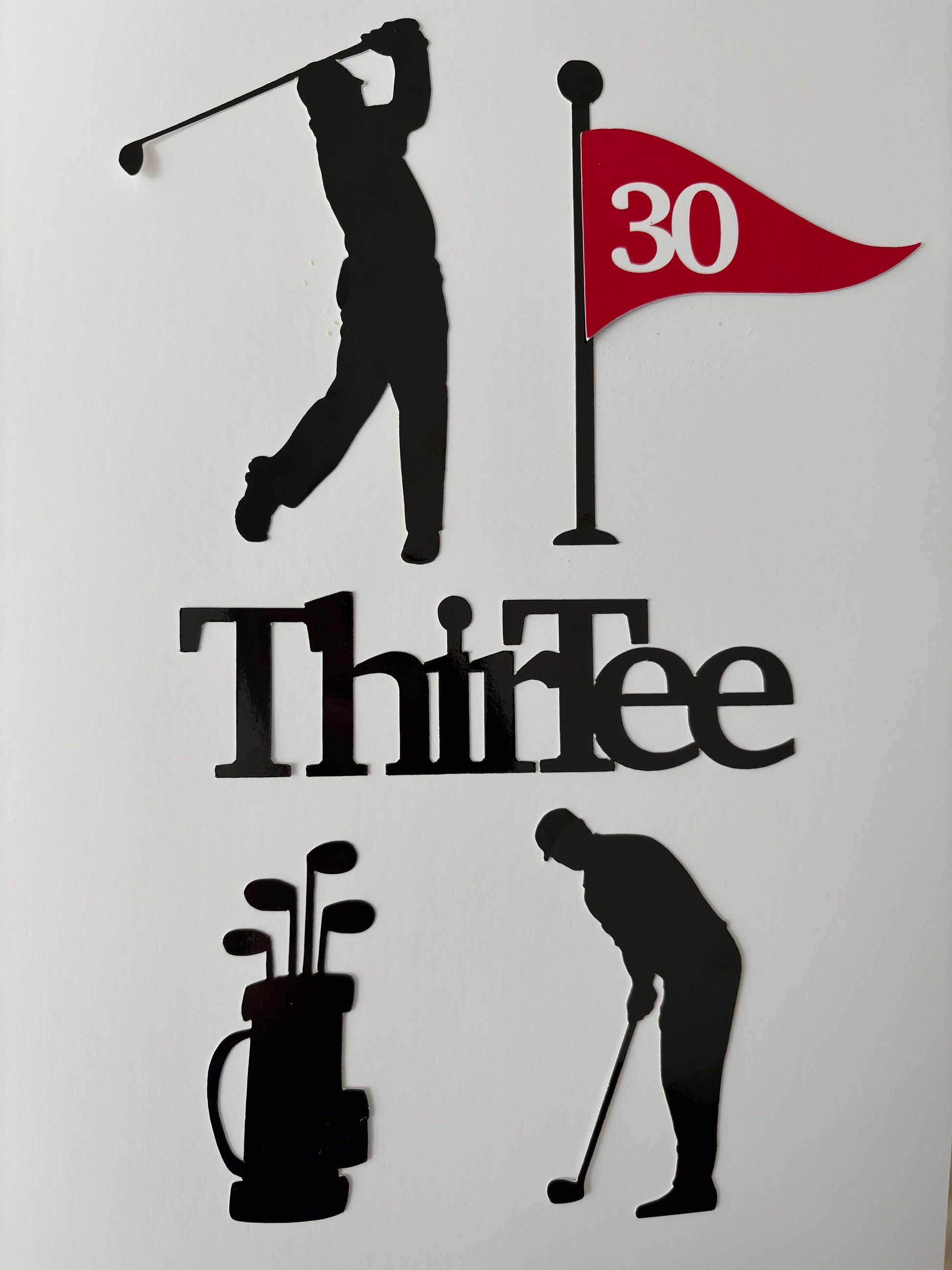 Golf-themed wall decor featuring black silhouette cutouts of a golfer, a flag with a red '30' and black pole, the word 'ThirTee' in black, a black golf bag with clubs, and another golfer silhouette, all arranged on a plain white background.